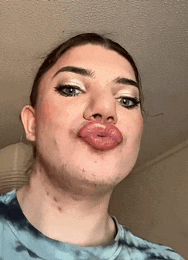 a woman is making a funny face with her mouth open
