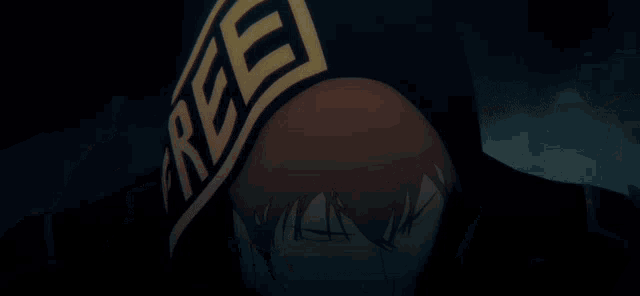 a close up of a person 's face with a hat on