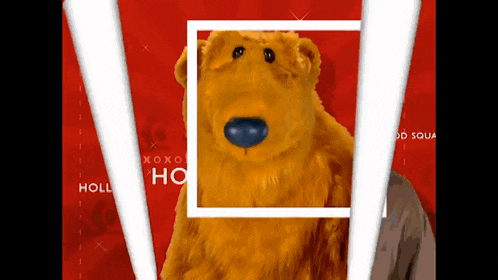 a stuffed animal with a blue nose is surrounded by a white square with the words holly ho on it