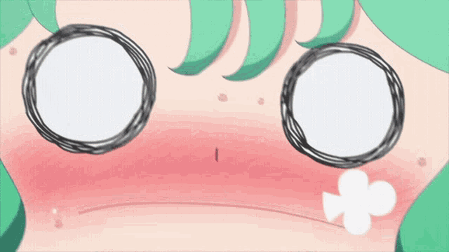 a close up of a cartoon character with green hair