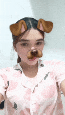 a girl wearing a dog mask takes a picture of herself