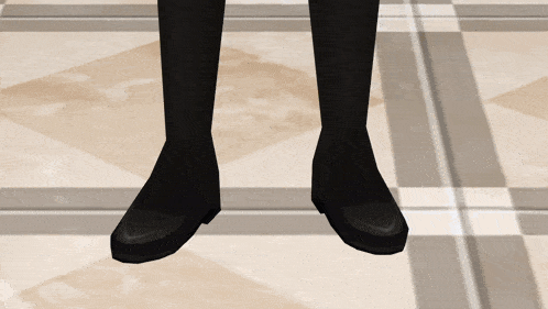a pair of black boots are standing on a checkered floor