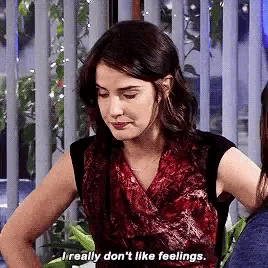 a woman in a red scarf is talking about her feelings .