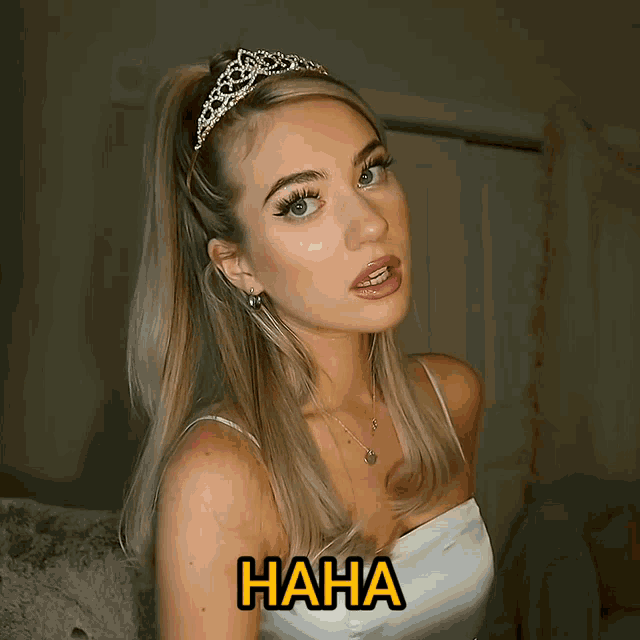 a woman with a tiara on her head and the word haha on the bottom right