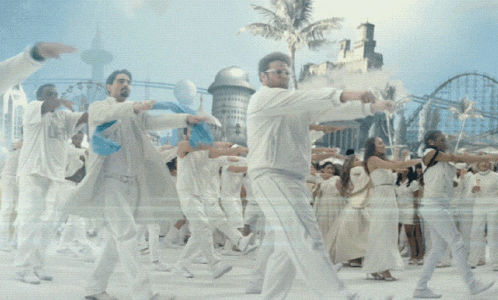 a man in a white jacket is dancing with a crowd of people