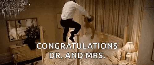 a man is jumping on top of a bed with the words `` congratulations dr. and mrs. '' .