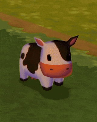 a black and white cow with an orange nose is standing on a grassy field