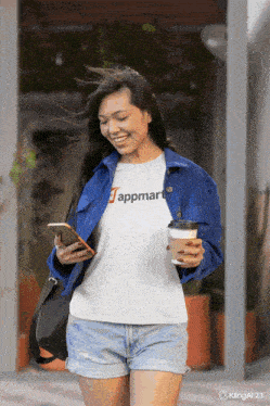 a woman wearing a white t-shirt that says appmart