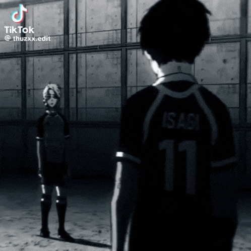 a man with the number 11 on his shirt stands next to another man