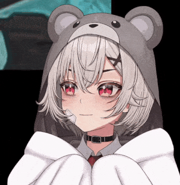 a close up of a girl wearing a teddy bear hat