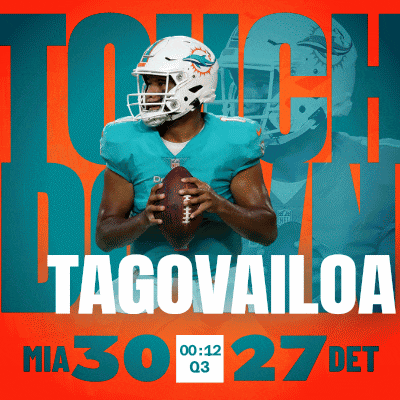 miami dolphins quarterback tagovailoa is holding a football in his hands