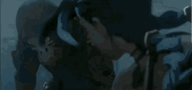 a close up of a person 's face with a blue light coming out of it