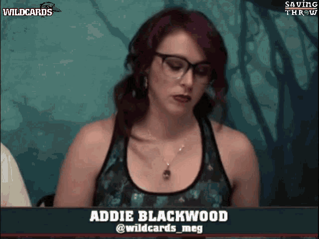 a woman with glasses and purple hair is on a wildcards video