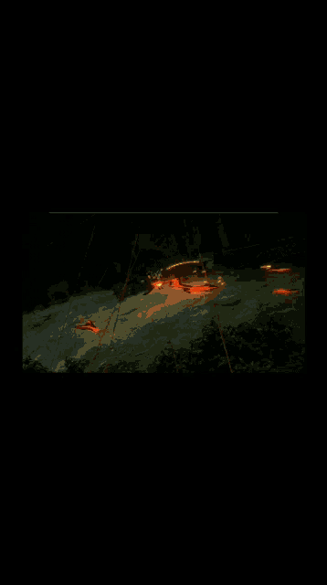 a samurai is surrounded by flames in a dark room