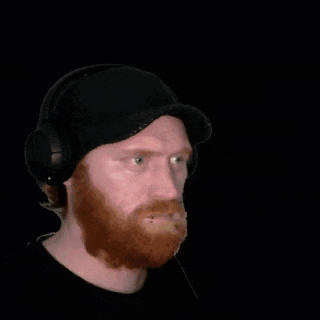 a man wearing headphones is looking at a treasure chest that says jaaackypott