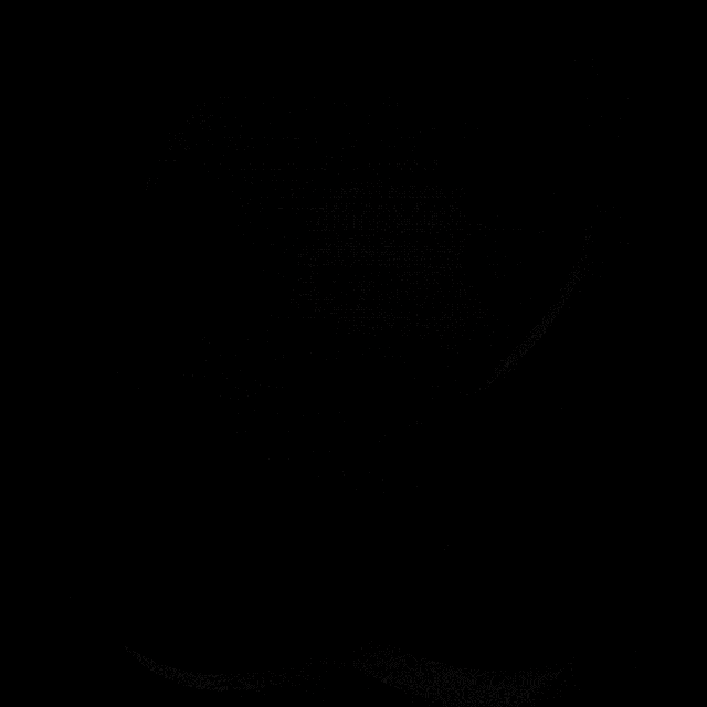 a close up of a metal object on a black surface