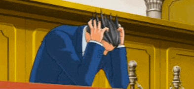 a man in a suit is holding his head in his hands .