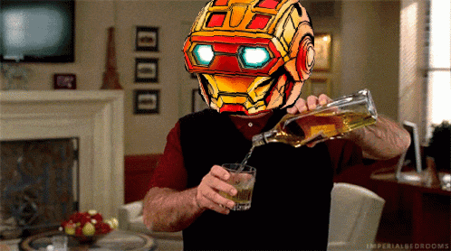 a man wearing a robot helmet is pouring a glass of whiskey