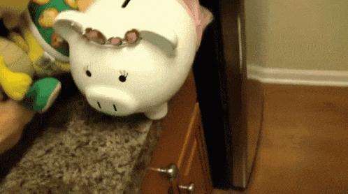 a white piggy bank with sunglasses on its face