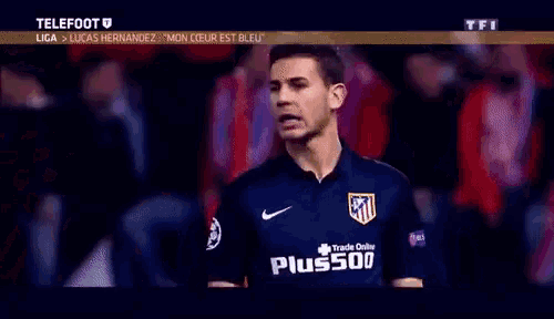 a soccer player is wearing a blue shirt that says trade online on it