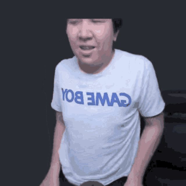 a man wearing a white t-shirt that says yo8 emao