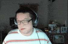 a man wearing headphones and a striped shirt