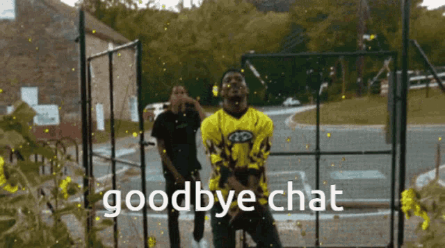 a man in a yellow shirt says goodbye chat in front of a basketball court