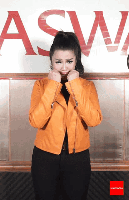a woman making a face in front of a sign that says a & w