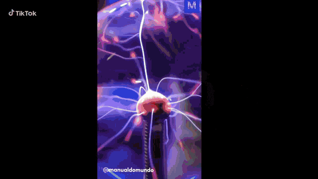 a tiktok video of a tesla coil with a purple background