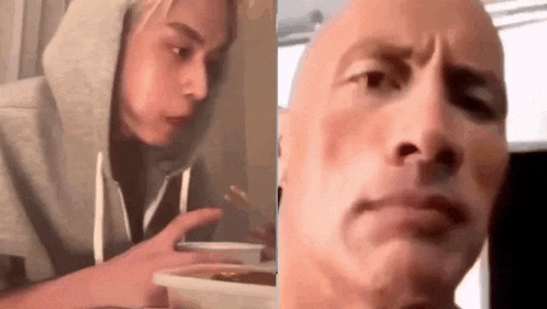 a woman in a hoodie is eating a bowl of food next to a man with a serious look on his face .