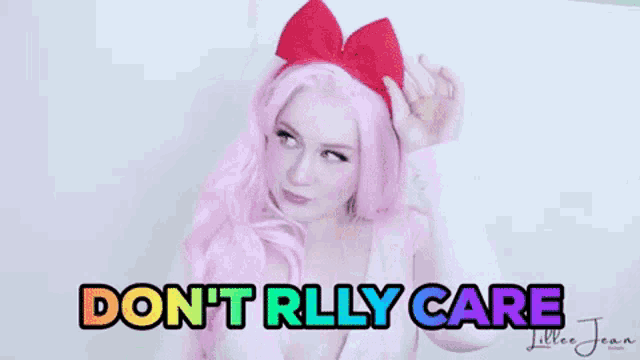 a woman with pink hair and a red bow on her head says `` do n't rlly care ''