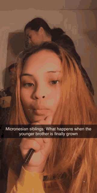 a girl with a pen in her hand has a caption that starts with micronesian siblings