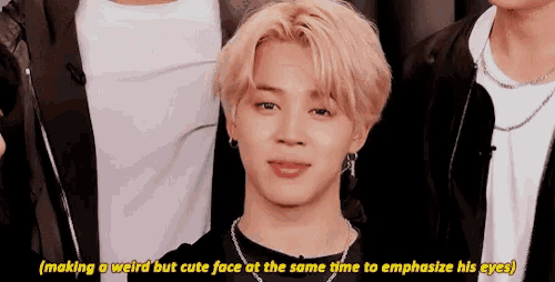 a man with blonde hair is making a weird but cute face at the same time to emphasize his eyes
