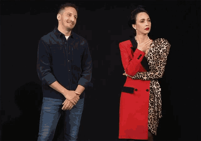 a man and woman are standing next to each other