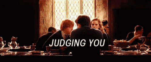 a group of people are sitting at a table with the words judging you written on the bottom