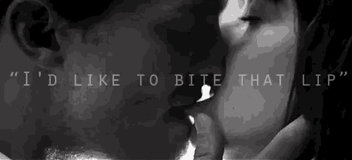 a man and a woman are kissing in a black and white photo with a quote .