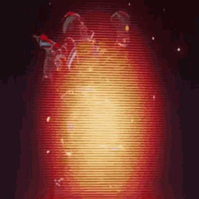 a person is standing in front of a red and yellow glowing object .