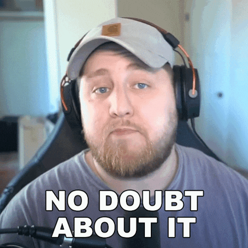 a bearded man wearing headphones and a hat says no doubt about it