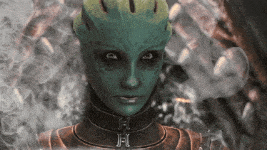 a close up of a green alien 's face with the letters j and c visible