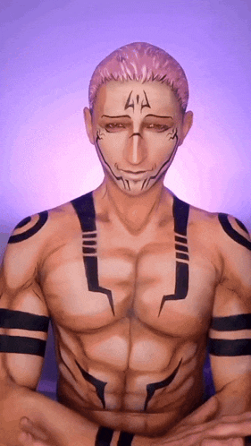 a man with his face painted like a cartoon character is sitting in a lotus position with his arms crossed .