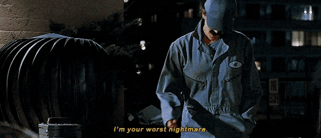 a man in a blue hat says i 'm your worst nightmare while covering his face