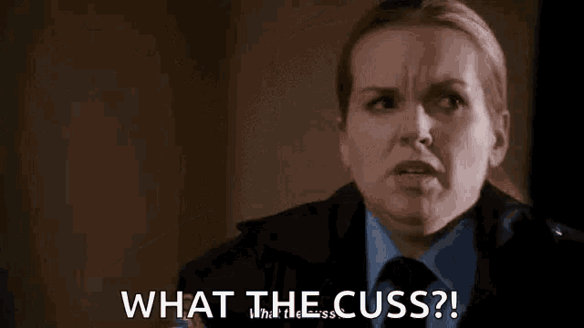 a woman in a police uniform is making a funny face and says `` what the cuss ? ''