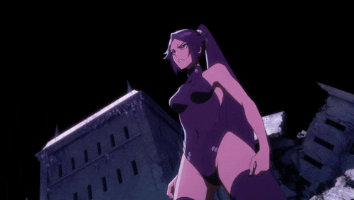 a woman in a purple swimsuit stands in front of a building