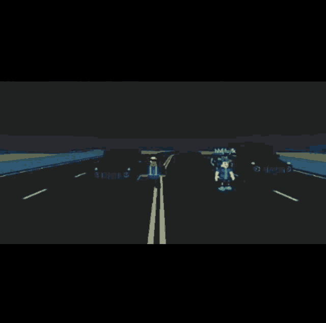 two white sports cars are driving down a road in the dark