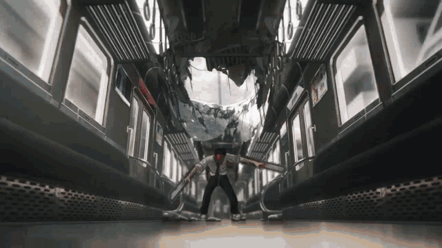 a man is standing in the middle of a subway car