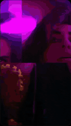a pixelated image of a man 's face with a green light coming out of his eye