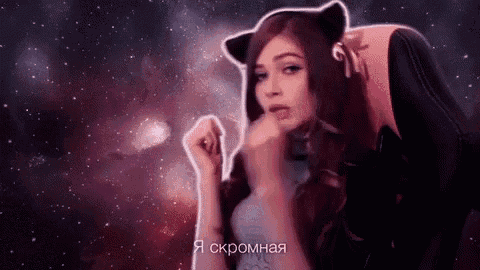 a woman in a cat costume is sitting in a chair with a galaxy in the background .