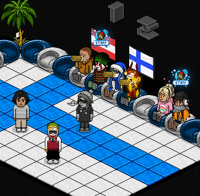 a group of people are sitting in chairs with a sign that says staff on it