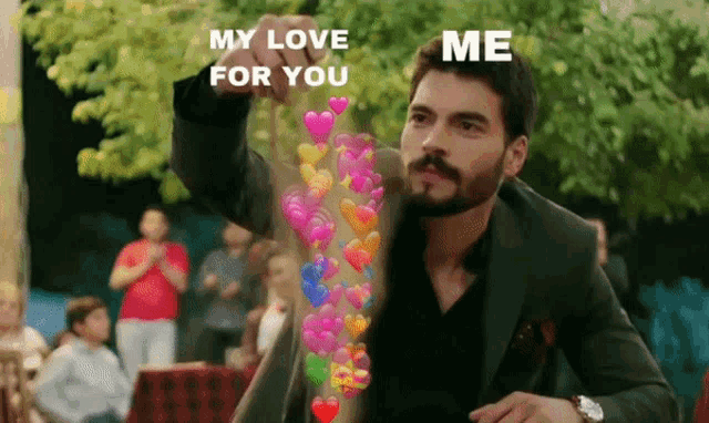 a man in a suit is holding up hearts that say " my love for you me "
