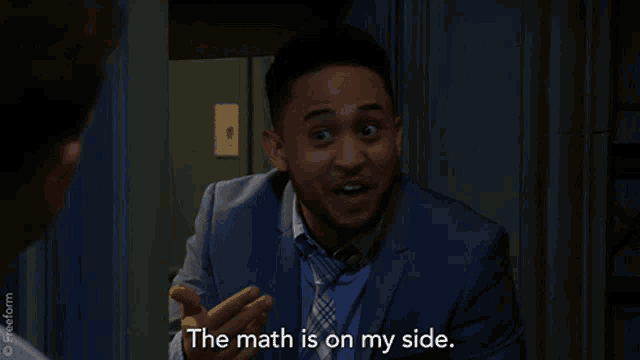 a man in a suit and tie is smiling and saying the math is on my side